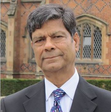 Head shot of Binod Maitin in front of Lanyon Building