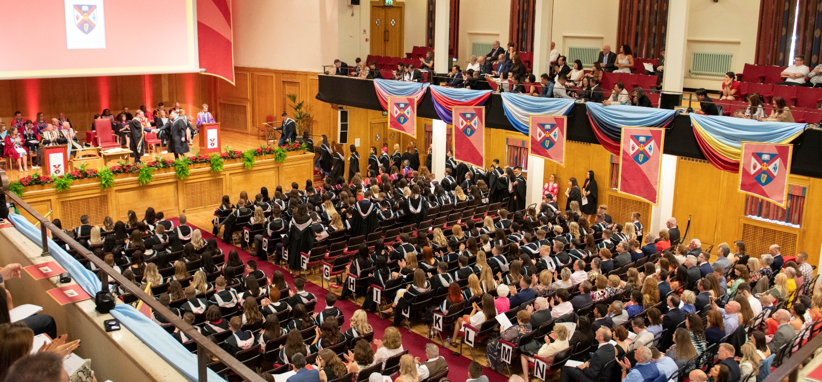 Graduation ceremony in a packed Sir William Whitla Hall at Queen's