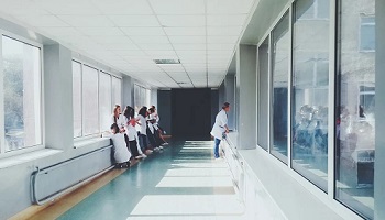 Hospital corridor with female nurses and doctors in white coats