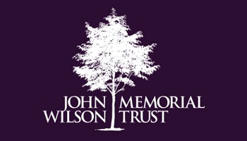 John Wilson Memorial Trust logo featuring silhouetted tree in centre of wording