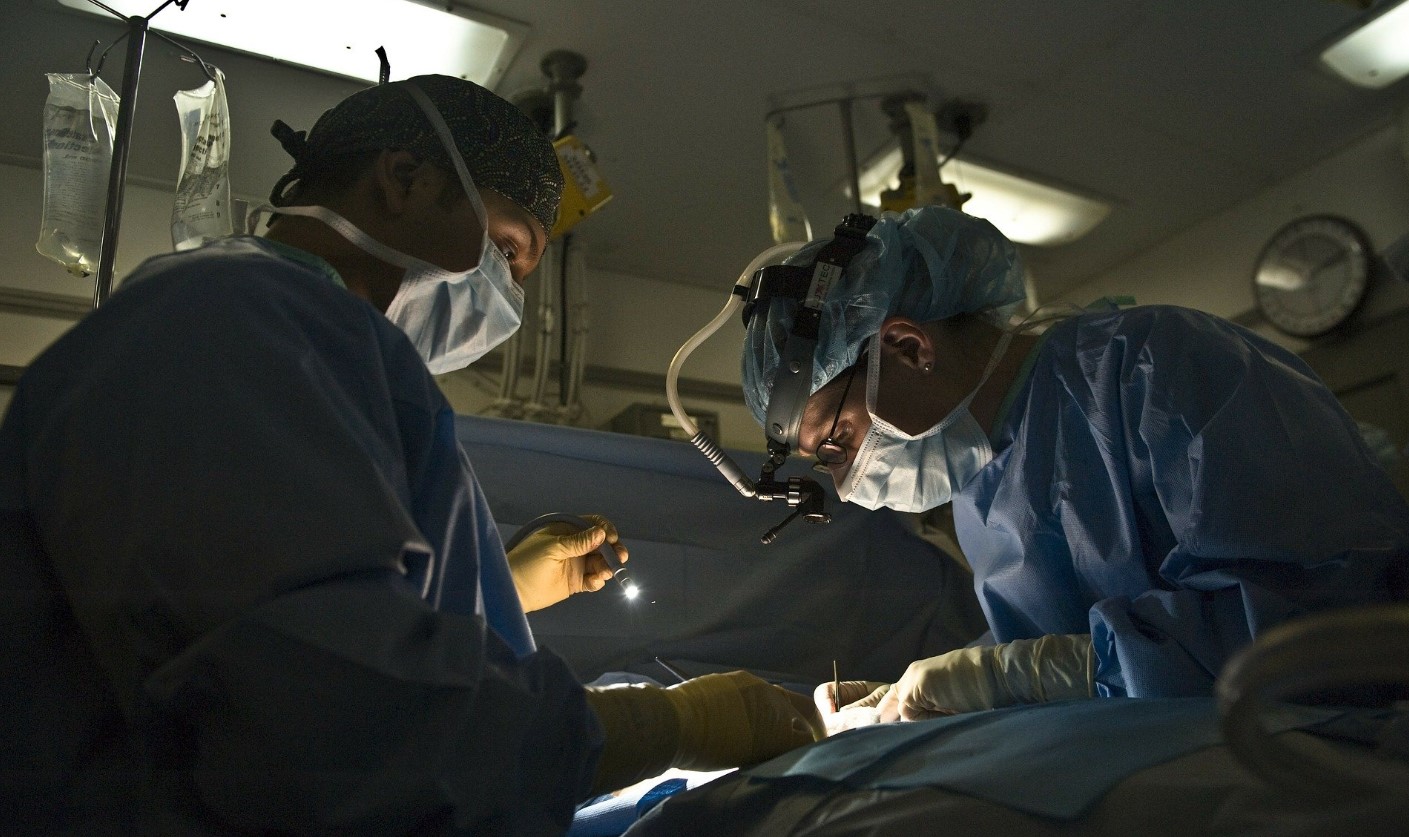 Surgeons undertaking operation