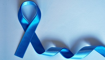 Blue ribbon against light blue background