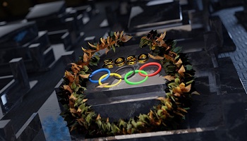 Olympic rings surrounded by winner's garland