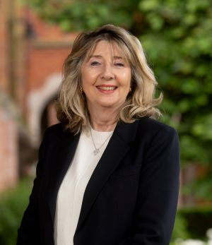 June Coppel in front of QUAD Cloisters 