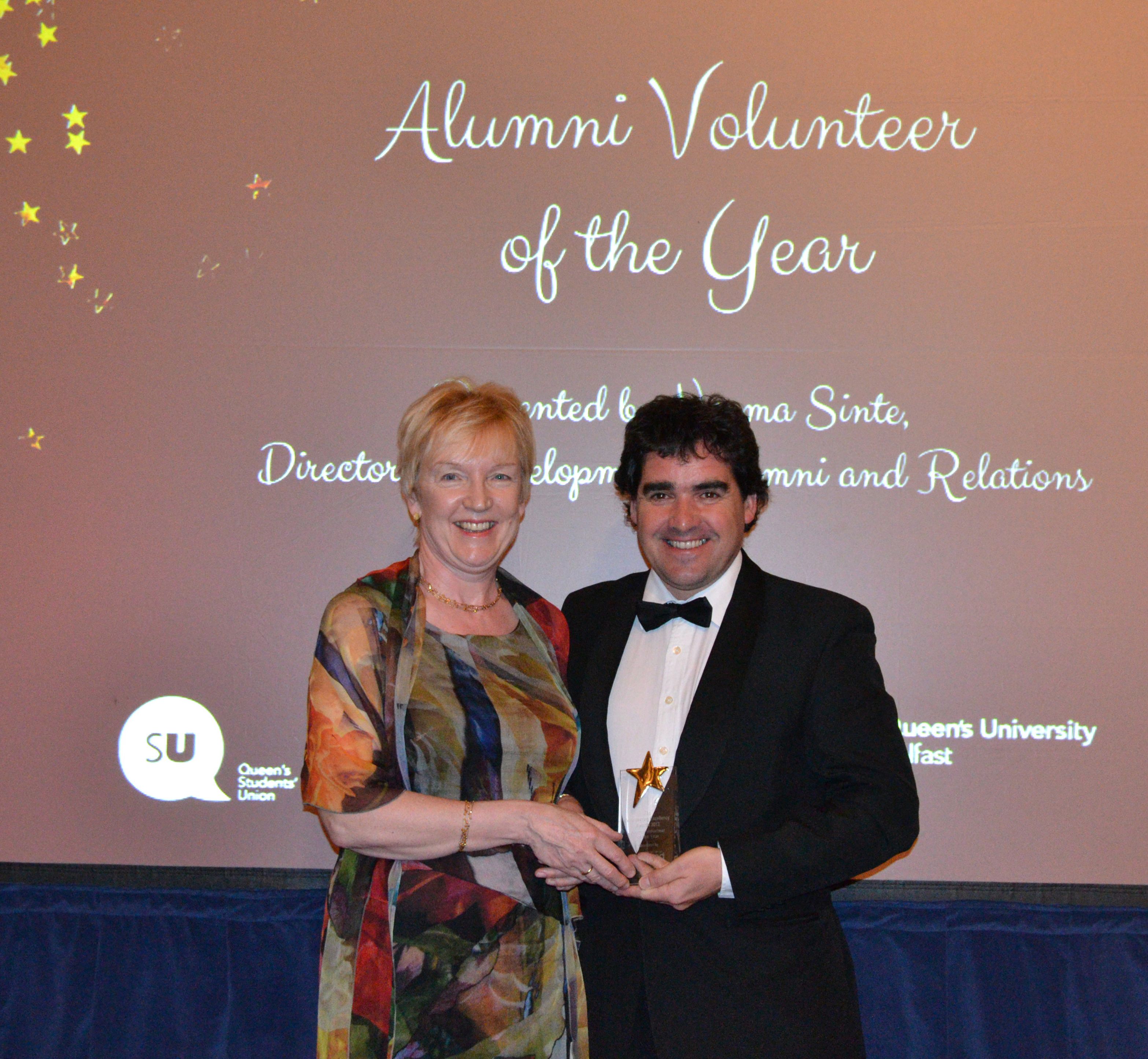 Norma Sinte, Director of Development at Queen's, presents Dr Clive Black with the 2013 Graduate Volunteer of the year Award